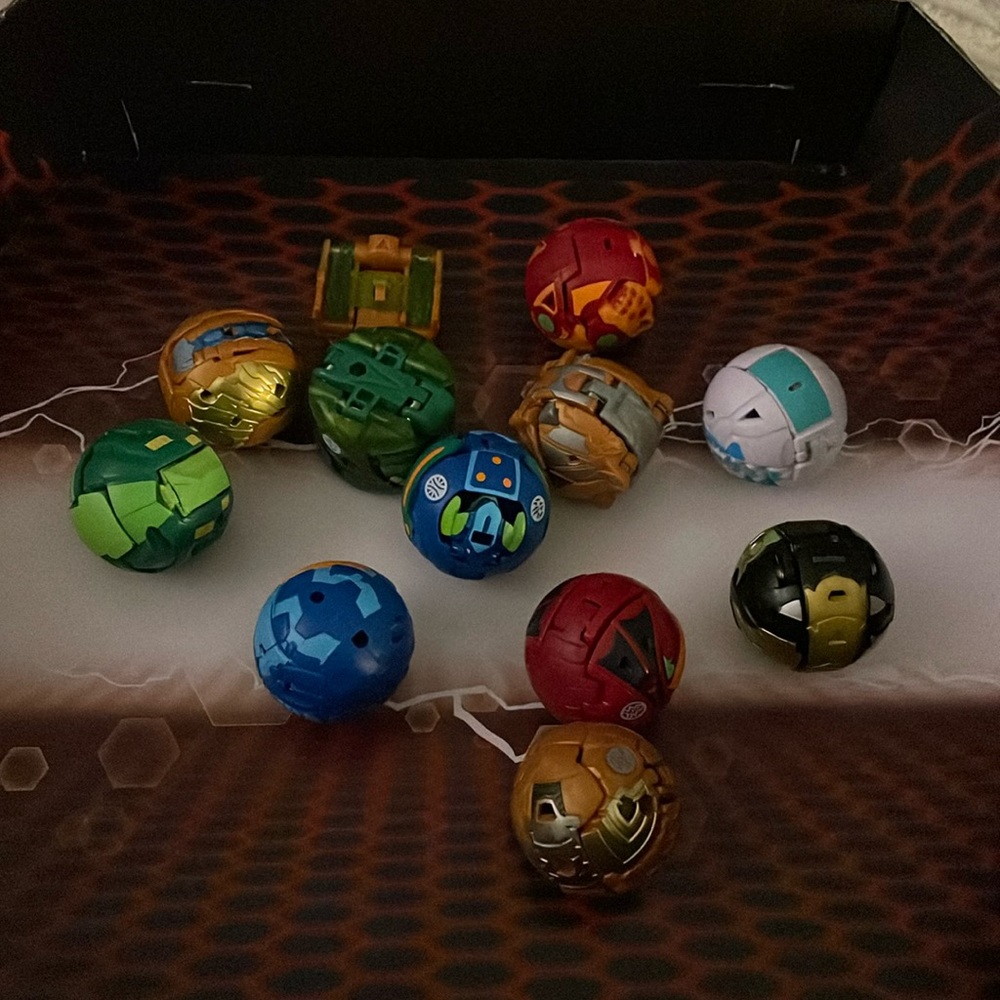 Lot of Bakugan battle figures.